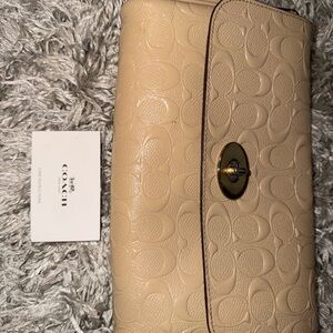 Coach women’s Tan Leather Logo Patch Bag crossbody